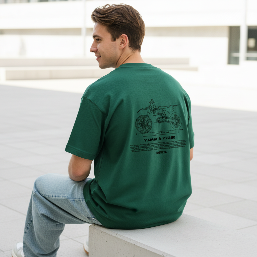 Male model back pose - sitting ledge urban plaza - Yamaha YZ250 bottle green tee